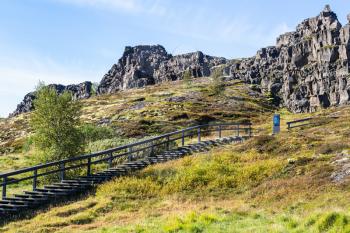 travel to Iceland - tourist path to Logberg (Law Rock) mountain in Thingvellir national park in september