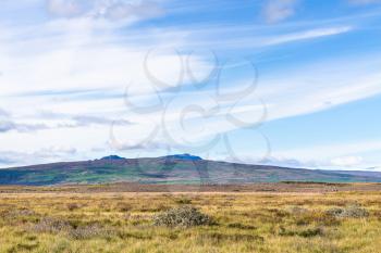 travel to Iceland - blue sky with white clouds over icelandic meadow near Biskupstungnabraut road near Gullfoss waterfall in autumn
