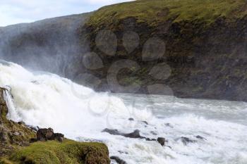 travel to Iceland - view of Gullfoss waterfall current from canyon edge in autumn