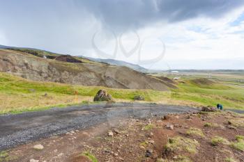travel to Iceland - tourists on dirt road in Hveragerdi Hot Spring River Trail area in september