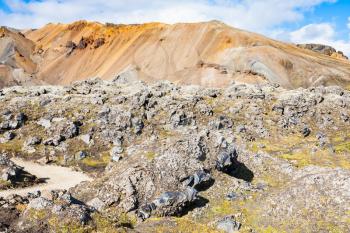travel to Iceland - path to at Laugahraun volcanic lava field in Landmannalaugar area of Fjallabak Nature Reserve in Highlands region of Iceland in september
