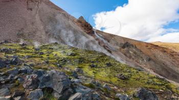 travel to Iceland - hot sptings on mountain slope in Landmannalaugar area of Fjallabak Nature Reserve in Highlands region of Iceland in september