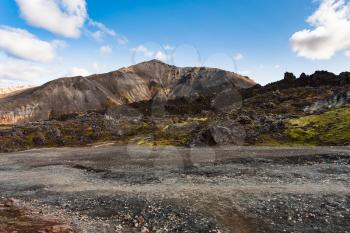 travel to Iceland - volcanic ground near Laugahraun lava field in Landmannalaugar area of Fjallabak Nature Reserve in Highlands region of Iceland in september
