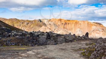 travel to Iceland - footpath in Laugahraun volcanic lava field in Landmannalaugar area of Fjallabak Nature Reserve in Highlands region of Iceland in september