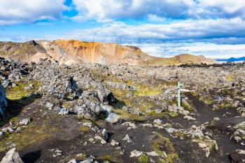 travel to Iceland - waymark at Laugahraun volcanic lava field in Landmannalaugar area of Fjallabak Nature Reserve in Highlands region of Iceland in september