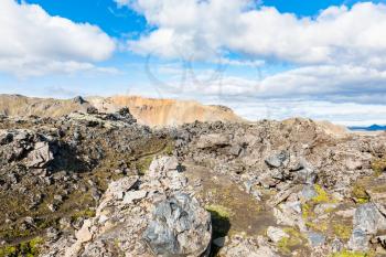 travel to Iceland - old stones at Laugahraun volcanic lava field in Landmannalaugar area of Fjallabak Nature Reserve in Highlands region of Iceland in september