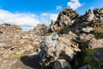 travel to Iceland - volcanic rocks in Laugahraun lava field in Landmannalaugar area of Fjallabak Nature Reserve in Highlands region of Iceland in september