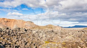 travel to Iceland - panorama of Laugahraun volcanic lava field in Landmannalaugar area of Fjallabak Nature Reserve in Highlands region of Iceland in september