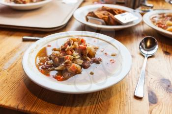 travel to Iceland - plate with Kjotsupa, traditional Icelandic Lamb Soup in Reykjavik city restaurant in september