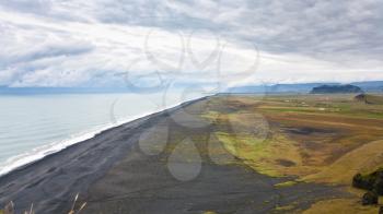 travel to Iceland - above view of Solheimafjara shore from Dyrholaey cape near Vik I Myrdal village on Atlantic South Coast in Katla Geopark in september