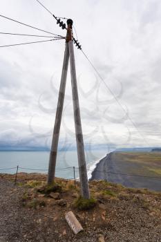 travel to Iceland - electric wire post on Dyrholaey peninsula near Vik I Myrdal village on Atlantic South Coast in Katla Geopark in september