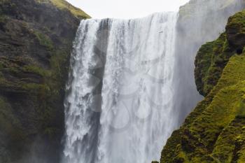 travel to Iceland - water flows of Skogafoss waterfall in Katla Geopark on Icelandic Atlantic South Coast in september