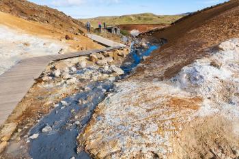 travel to Iceland - pathway near hot water flow in geothermal Krysuvik area on Southern Peninsula (Reykjanesskagi, Reykjanes Peninsula) in september
