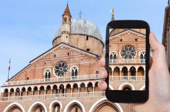 travel concept - tourist photographs Basilica of Saint Anthony of Padua on piazza del Santo in Padua city in Italy on smartphone