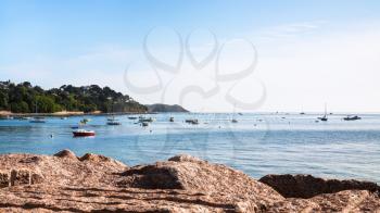travel to France - boats near Saint-Guirec beach of Perros-Guirec commune on Pink Granite Coast of Cotes-d'Armor department in the north of Brittany in sunny summer morning