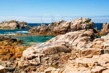 travel to France - rocky coasline of Ile-de-Brehat island in Cotes-d'Armor department of Brittany in summer sunny day