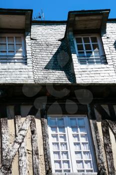travel to France - facade of medieval half-timbered house in Vitre town in Ille-et-Vilaine department of Brittany in sunny summer day