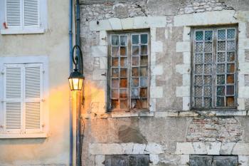travel to France - lantern on wall of old urban houses in Orleans city on street Rue de la Charpenterie in summer evening