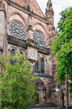 trave to France - clock tower of Strasbourg cathedral in summer evening
