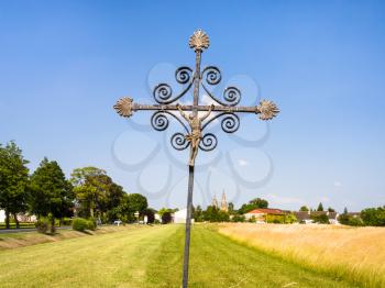 travel to France - old Christian cross in cereal field near commune L'Epine Marne in sunny summer day in Champagne region of France
