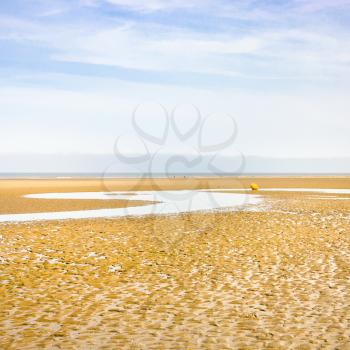 travel to France - blue sky over sand beach of Le Touquet after ebb tide (Le Touquet-Paris-Plage) on coast of English Channel