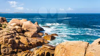 travel to France - rocky coast of English Channel in Ploumanac'h site of Perros-Guirec commune on Pink Granite Coast of Cotes-d'Armor department in the north of Brittany in sunny summer day