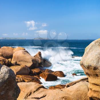 travel to France - stone coast of English Channel in Ploumanac'h site of Perros-Guirec commune on Pink Granite Coast of Cotes-d'Armor department in the north of Brittany in sunny summer day