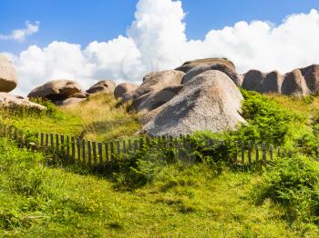 travel to France - granite rocks in natural park of Ploumanac'h site of Perros-Guirec commune on Pink Granite Coast of Cotes-d'Armor department of Brittany in sunny summer day