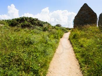 travel to France - path in natural park of Ploumanac'h site of Perros-Guirec commune on Pink Granite Coast of Cotes-d'Armor department of Brittany in sunny summer day