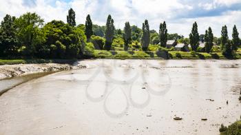 travel to France - muddy Jaudy river near la Roche-Derrien village in Cotes-d'Armor department of Brittany in sunny summer day