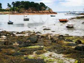 travel to France - ships in Port-Clos harbour of Ile-de-Brehat island in Cotes-d'Armor department of Brittany in during low tide in summer