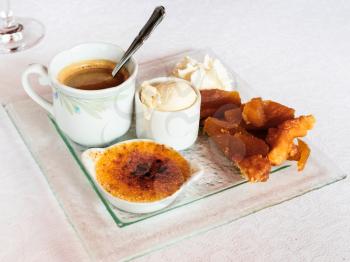 travel to France - plate with french dessert coffee gourmet from espresso, ice cream, creme brule, apple pie in restaurant of Cancale town in Brittany