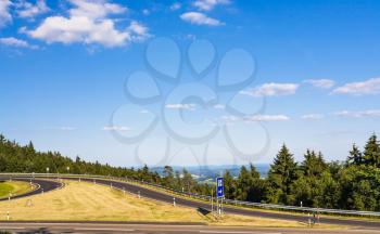 travel to Germany - view of road on Rimberg mount to Rest and Service Station on Autobahn A5 motorway near Breitenbach am Herzberg town in Hesse State of Germany in summer day