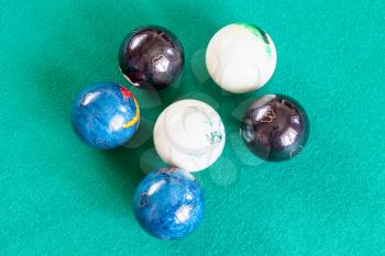 three pairs of various chinese baoding balls on green baize table