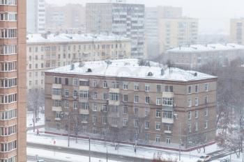 snowfall over street in Moscow city in cold wither day