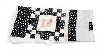 patchwork silk scarf sewn from various polka dots fabrics isolated on white background