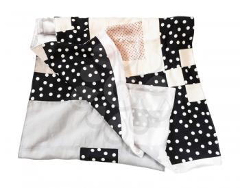folded patchwork silk scarf sewn from various polka dots fabrics isolated on white background