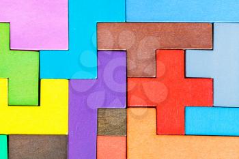 top view of assembled puzzle from colored wooden pentominoes and blocks