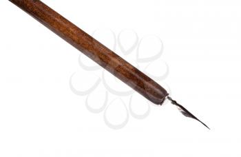 side view of black painted nib in brown dip pen close up isolated on white background