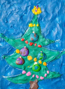 hand made New Year greeting card with decorated christmas tree molded with plasticine
