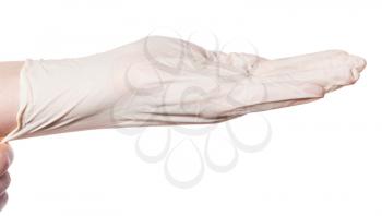 side view of hand pulls latex glove on palm isolated on white background