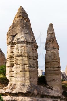 Travel to Turkey - two fairy chimney rocks in Goreme National Park in Cappadocia in spring