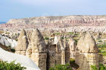 Travel to Turkey - fairy chimney rocks in mountain valley of Goreme National Park in Cappadocia in spring