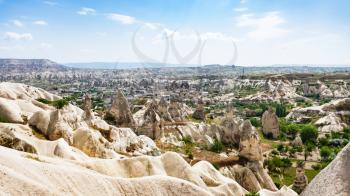 Travel to Turkey - mountains slope and Goreme town in Cappadocia in spring