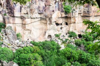 Travel to Turkey - above view of rocky slope with ancient caves in Ihlara Valley of Aksaray Province in Cappadocia in spring