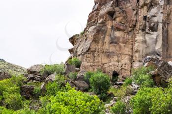 Travel to Turkey - slope with ancient cave houses in Ihlara Valley of Aksaray Province in Cappadocia in spring