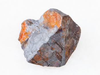 macro shooting of natural rock specimen - raw Hematite ore on white marble background from Brazil