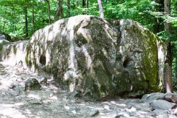 tour to Shapsugskaya anomalous zone - carved rock in prehistoric Shambala stone-pit in Abinsk Foothills of Caucasus Mountains in Kuban region of Russia