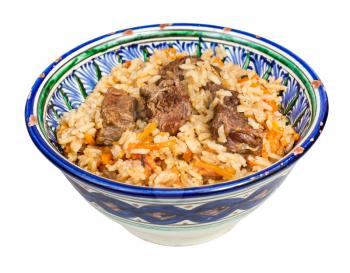 above view of cooked pilau (central asian dish from rice with meat and vegetable) in traditional ceramic bowl isolated on white background