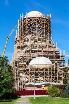 construction of tower of orthodox church of Saint Spyridon (St Spiridon) Bishop of Trimythous in Koptevo district of Moscow on sunny summer day